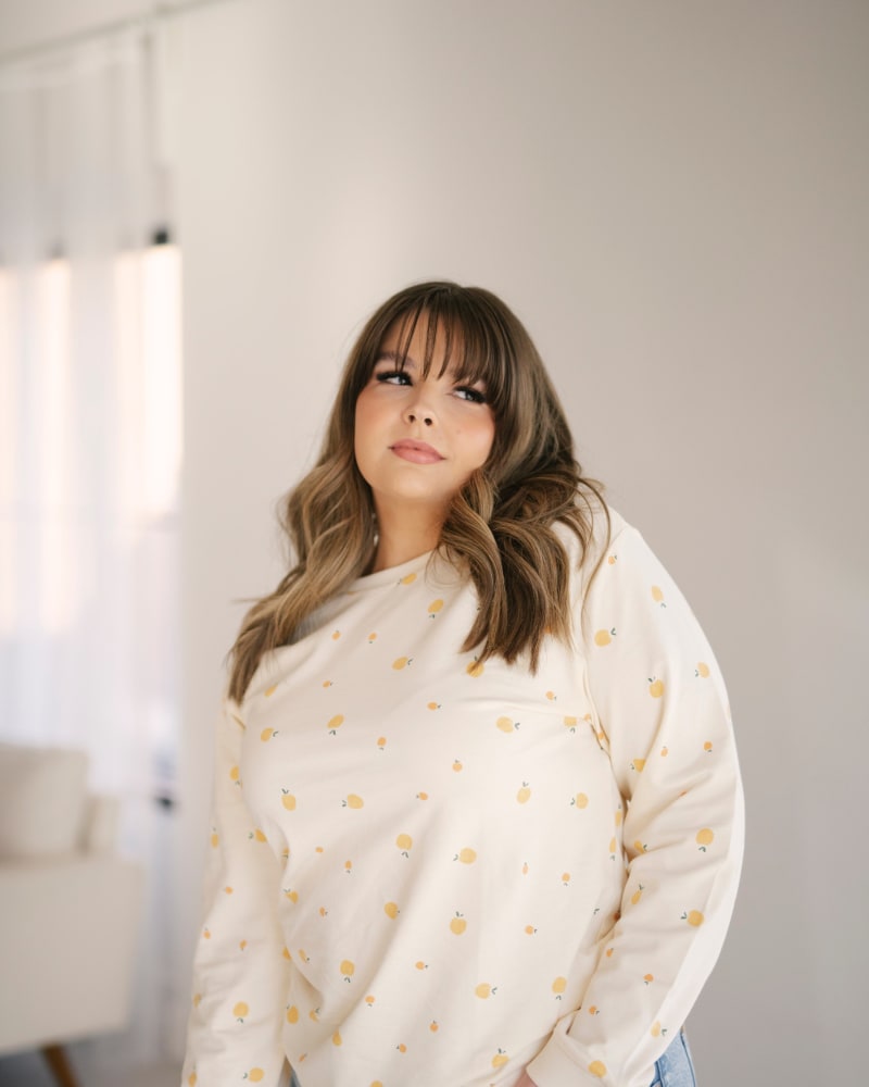 Front of a model wearing a size Large Peachy Keen Organic Cotton Pullover in White by Polished Prints. | dia_product_style_image_id:239759